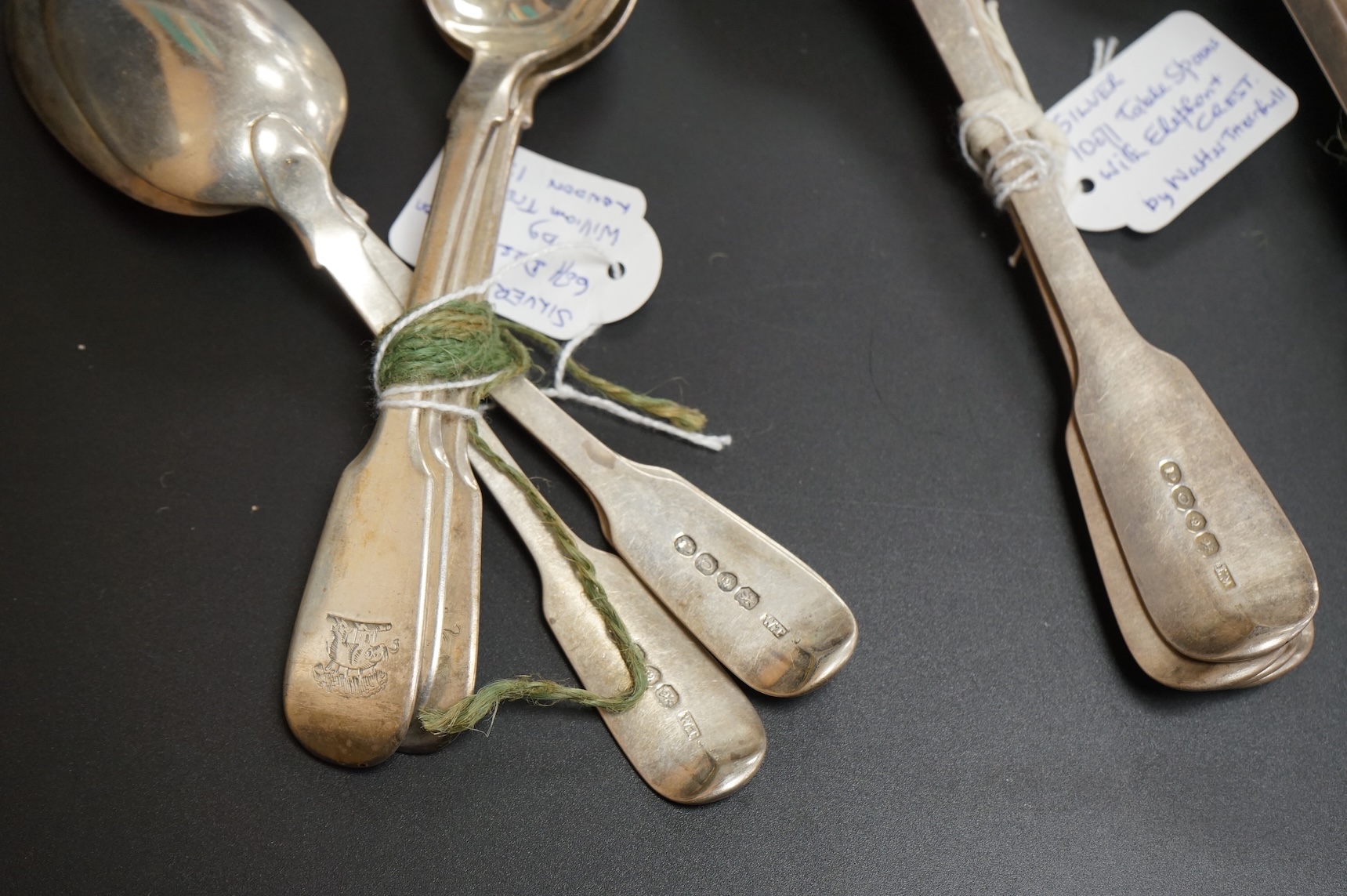 A set of ten George IV silver fiddle pattern table spoons and five dessert spoons by William M. Traies, London, 1829 and one other matched silver dessert spoon, 32.7oz.